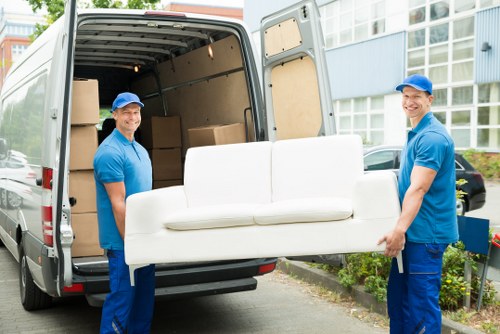 Specialist piano removal team transporting a piano safely