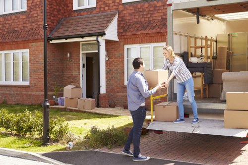 Man with van loading furniture in Harrow