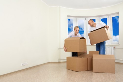 Organized storage unit in Harrow with boxes and furniture
