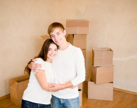 Removal team preparing boxes and furniture safely at a property