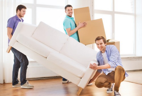 Secure loading of protected furniture items for removals in Harrow