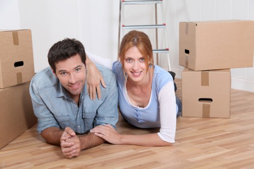 Removal team loading furniture for a house move in Harrow