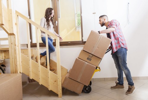 Team conducting a moving risk assessment before lifting furniture