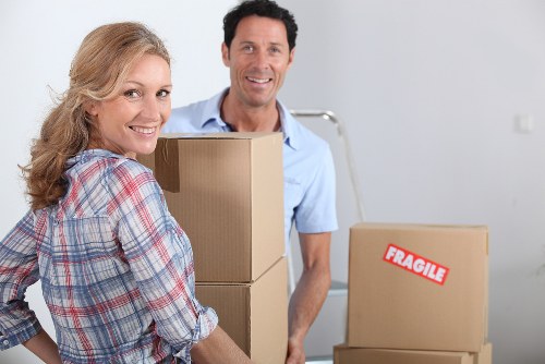 Careful unloading of household items at a new Harrow property