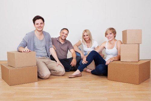Professional Harrow removal team packing fragile household items