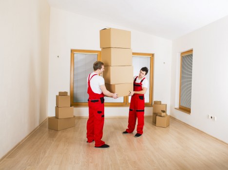 Harrow removals crew handling office relocation equipment