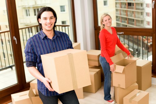 Local movers loading items into a removal van in Harrow